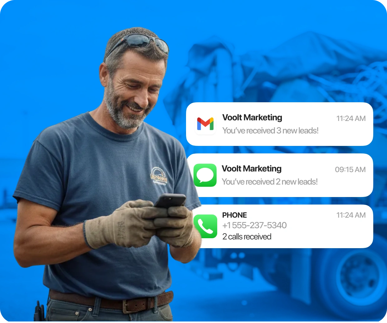 Smiling man in overalls receiving multiple new lead notifications from Voolt Marketing on his smartphone.