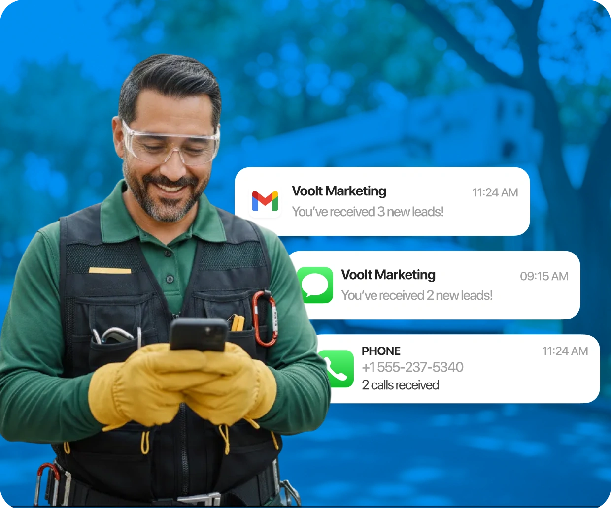 Smiling man in overalls receiving multiple new lead notifications from Voolt Marketing on his smartphone.